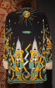 Back view of black jacket printed with Art Deco design of skyscrapers, sun and zeppelin in gold…