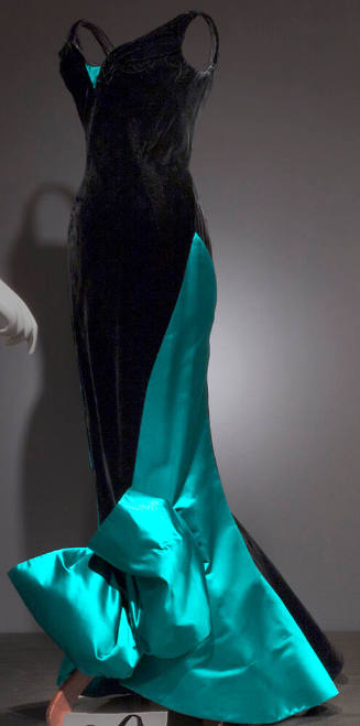 Black velvet sleeveless floor length sheath evening dress with deep green satin side panel endi…