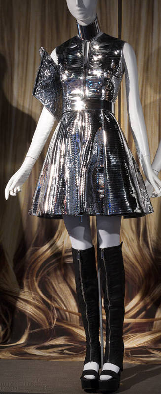 Silver metallic sleeveless dress with above the knee flared skirt, matching choker, belt and bl…