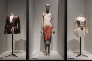 Fashioning Wonder exhibition installation view of three dressed mannequins in anatomical print …