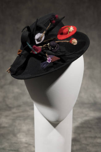 Black asymmetrical hat with self bow and multicolor miniature hats allover front brim