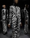 Alternate view of black and white zebra print gown positioned in front of mirrors that show bla…