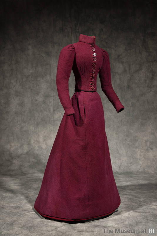 Dressmaker’s sample of miniature dark red two-piece dress with stand collar, button front bodic…
