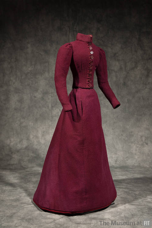 Dressmaker’s sample of miniature dark red two-piece dress with stand collar, button front bodic…