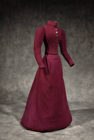 Dressmaker’s sample of miniature dark red two-piece dress with stand collar, button front bodic…
