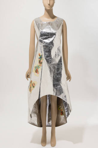Silver sleeveless dress with high low hem from knees to ankle and multicolor floral appliques t…