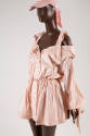 Closer view of pink nylon jacket with off-the-shoulder sleeves, bow tied camisole straps and ga…