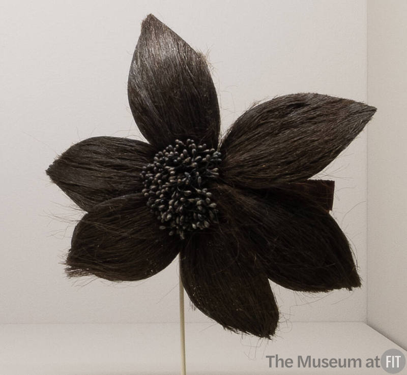 Brown horsehair hair comb in the shape of large flower