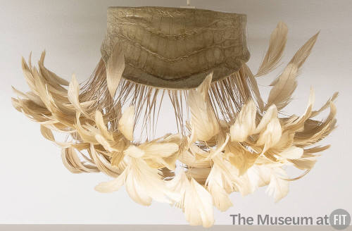 Beige alligator choker with matching feather plume fringe extending from bottom