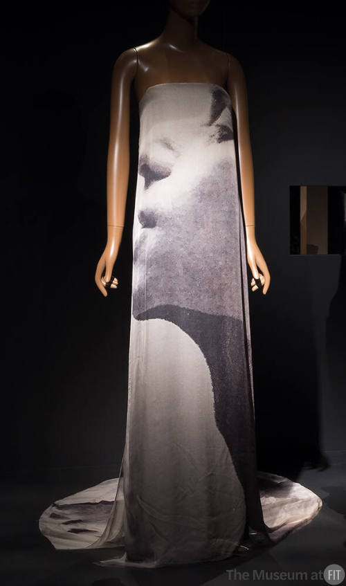 Strapless floor length evening dress with large brown and taupe abstract photo print of a woman…