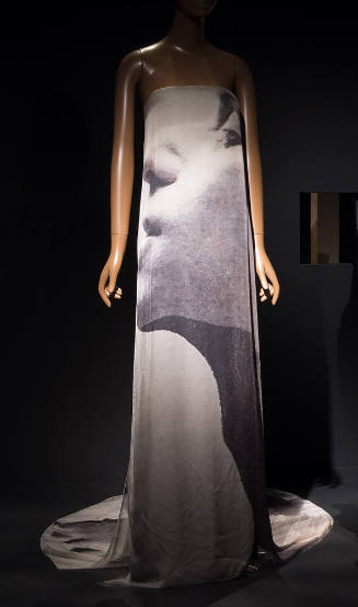 Strapless floor length evening dress with large brown and taupe abstract photo print of a woman…