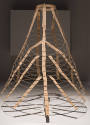 Cage underskirt of concentric wire circles connected by beige cotton tape shown fully extended