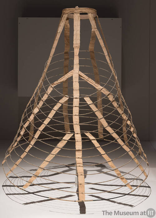 Cage underskirt of concentric wire circles connected by beige cotton tape shown fully extended