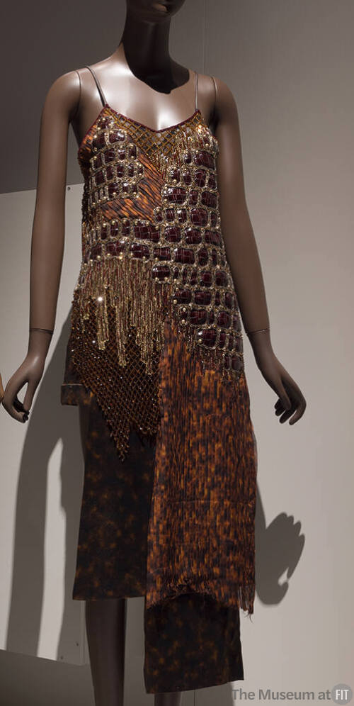 Camisole evening top with gold beadwork, brown faux alligator and orange chiffon asymmetrical h…