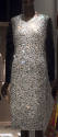 Cocktail dress of mirrored glass stones with long black sleeves 