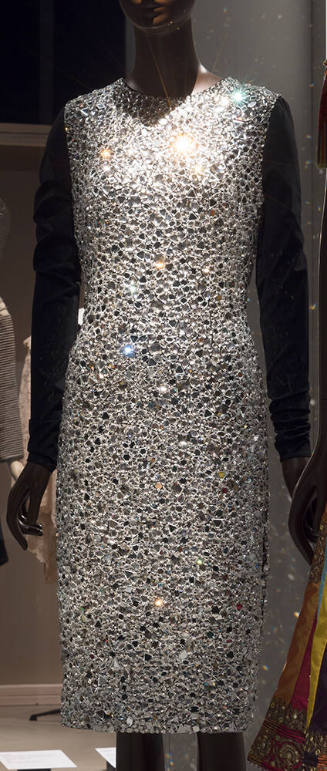 Cocktail dress of mirrored glass stones with long black sleeves 
