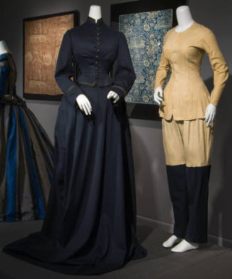 Two-piece floor length navy blue dress on left and coordinating beige long sleeve undershirt wi…