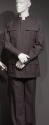Man’s grey safari style suit with stand collar, button front jacket and four button flap patch …