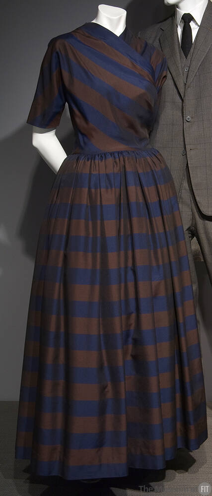Navy blue and brown striped floor length dress with diagonally striped crossover bodice and ful…