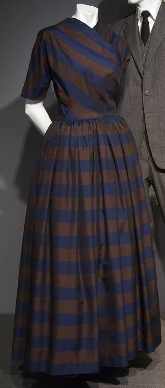 Navy blue and brown striped floor length dress with diagonally striped crossover bodice and ful…