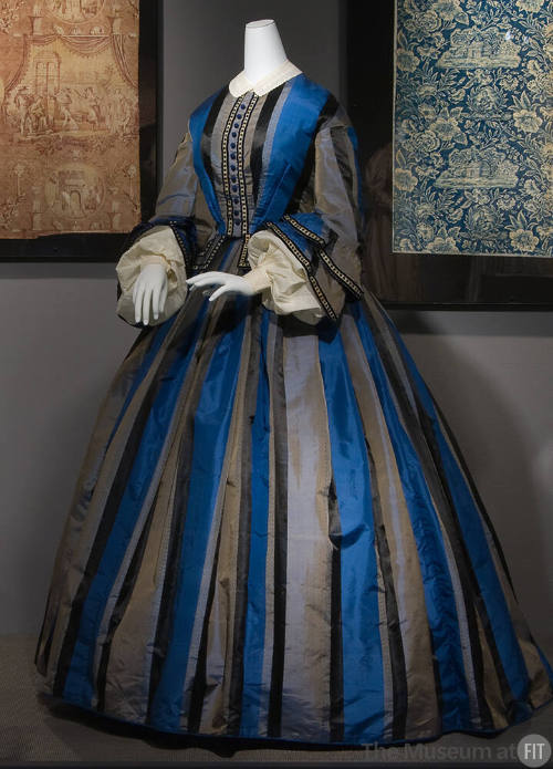 Blue, grey and black vertical striped floor length two-piece dress with fitted waist, two tired…