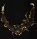 Necklace of brown net with shells, cork beads and purple, orange and bronze fish and coral shap…