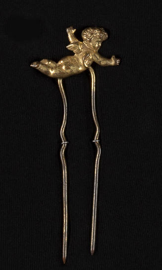Gold hairpin with flying cherub on top 