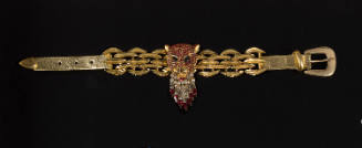 Gold choker necklace with red rhinestone panther head and clear tear drop fringe over gold link…