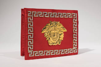 Red silk rectangular clutch evening bag with large gold Medusa ornament on center front and rhi…