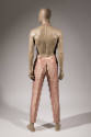 Rear view of man’s pink jumpsuit showing halter neck with open back, back hip pockets, center h…