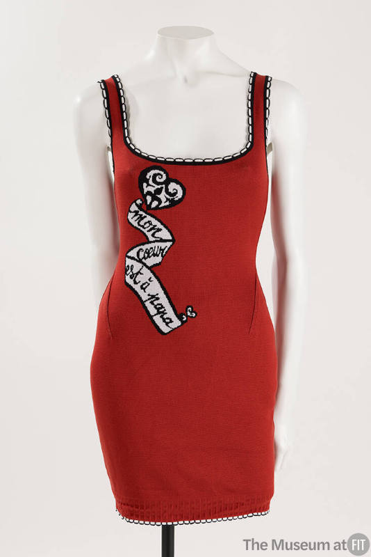 Red form fitting tank mini dress with a knit black and white heart and scroll inscribed “Mon co…