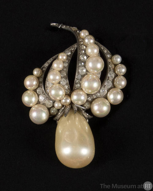 Large baroque pearl teardrop brooch with pearl and rhinestone arms at top resembling flames or …