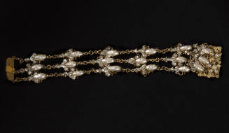 Three strand gold tone chain link bracelet with rows of oval pearls embellished with rhinestone…