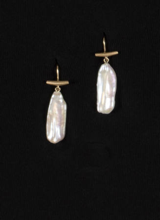 Pair of white Biwa pearl drop earrings hanging from gold T bar posts