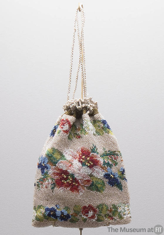 Small beaded drawstring pouch bag with multicolor floral beadwork on beige background 
