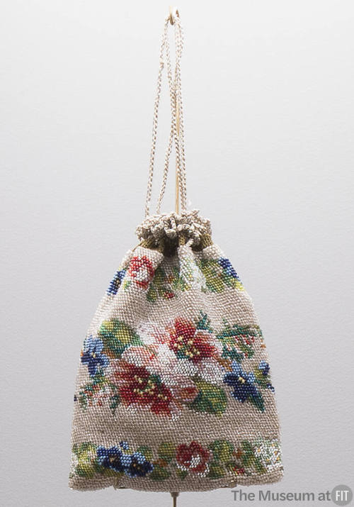 Small beaded drawstring pouch bag with multicolor floral beadwork on beige background 