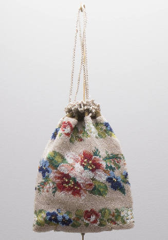 Small beaded drawstring pouch bag with multicolor floral beadwork on beige background 