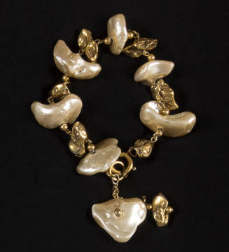 Bracelet of large white and small gold metallic baroque pearls on gold chain and one pair at cl…
