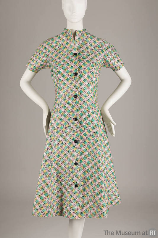 Short sleeve knee length A-line collarless dress made of pink, yellow, green and white interwov…