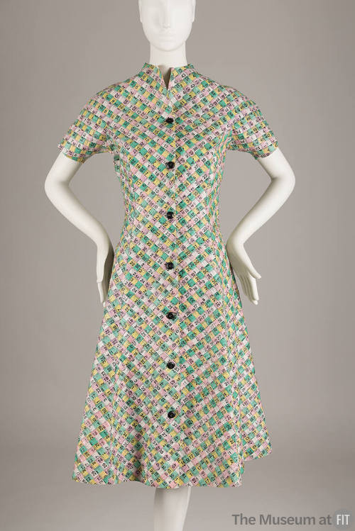 Short sleeve knee length A-line collarless dress made of pink, yellow, green and white interwov…