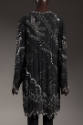 Back view of black evening jacket showing all-over abstract silver and copper beaded designs us…
