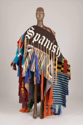 Deconstructed wrap coat consisting of many multicolor panels in a variety of weaves with tufted…