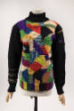 Turtleneck sweater with black neck and arms and multicolor purple, red, blue, green, white and …