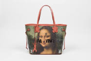 Large tote bag with print of the Mona Lisa’s face, dark reflective “Da Vinci” text in center, p…