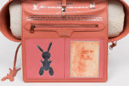 Interior view of Mona Lisa tote bag showing pink flap with zippered pocket, silver rabbit desig…