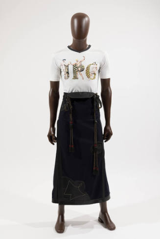 Man’s white short sleeve t-shirt with animal print JPG and three male figures and navy blue ank…