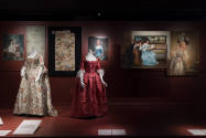 Art X Fashion exhibition installation view of two mannequins in 18th century dresses with sever…