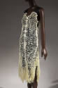 Off-white 3D-printed dress; plastic circular links crocheted with cotton, wide black leather sh…