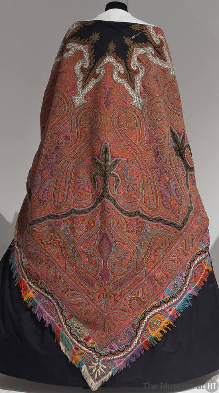 Paisley shawl with large central black star-shaped motif outlined in white and multicolor fring…