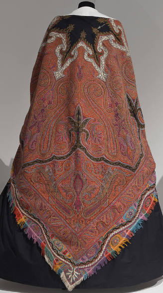 Paisley shawl with large central black star-shaped motif outlined in white and multicolor fring…